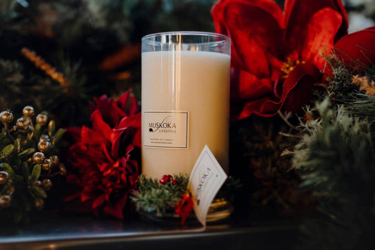 Pére Noel: a stunningly tall pillar candle that has a gorgeous French Pear and Brandy fragrance. It holds 600ml of wax and fragrance giving it a burn time of 130+ hours!!  It is adorned by mistletoe-inspired tinsel and iridescent cranberry beads around the base of the vessel, and it is finished with both pearlised label and swingtag, fastened with red organza ribbon.