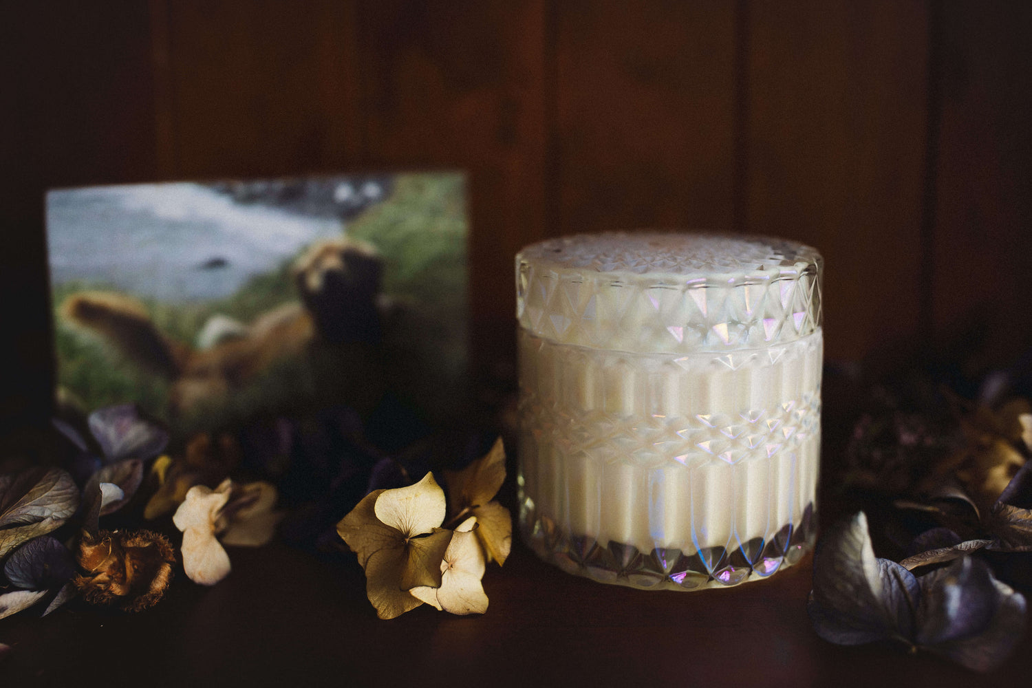 A gorgeous candle set in a Darcy style opal tinted cut glass vessel with lid that can be used as a jewellery box after the candle has completed its journey. This candle is designed to bring comfort to those who are grieving the loss of a loved and cherished pet.